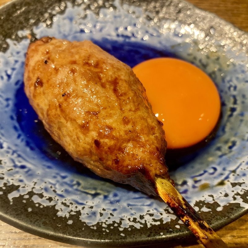 つくね【こだわりの玉子黄味付き 50円】(YAKITORI 燃 )の写真