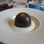 Chocolate sphere with milk ice cream and honeycomb