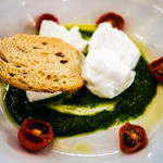 Buffalo mozzarella with dried tomatoes and ruccola pesto