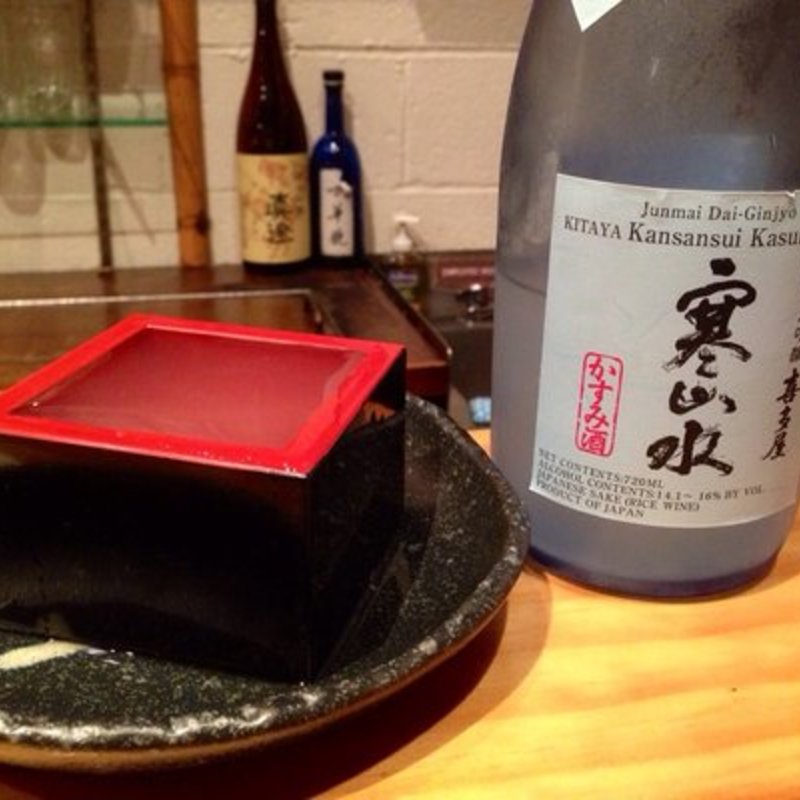 Sake served in masu cup(SAKAGURA)