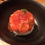 Salmon sashimi with roe on rice