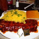 Ribs with yellow rice and corn bread