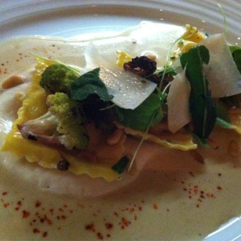 Pumpkin ravioli over puréed cauliflower in a brown butter sage sauce(Blue Fin)
