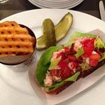 Lobster and shrimp roll with side of waffle fries