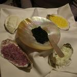 Royal sterling caviar served with creme fraiche, finely chopped egg yolks, egg whites and red onion