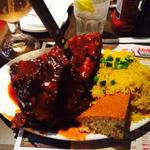 ribs with yellow rice and corn bread