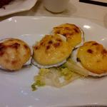 cheese covered baked scallops