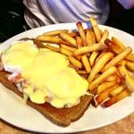 Eggs Benedict over bruschetta and whole wheat toast and a side of fries