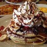 Banana and fresh strawberries pancakes and chocolate with whip cream(Brownstone Diner )