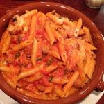 Penne a la vodka with prosciutto and onions