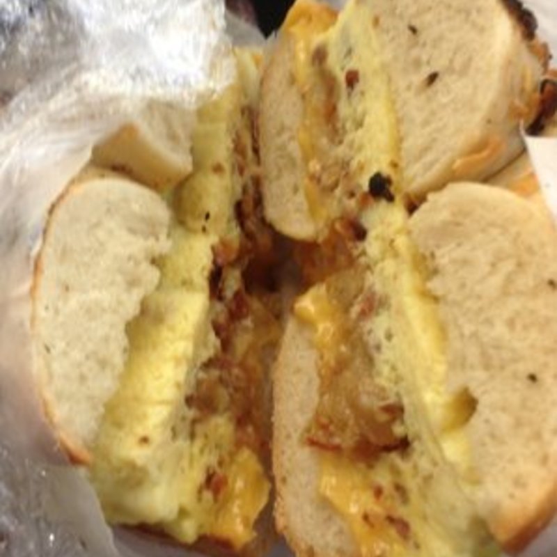 Hash brown, bacon & cheese omelet on garlic bagel(This Is It Too)