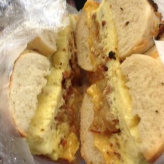 Hash brown, bacon & cheese omelet on garlic bagel(This Is It Too)