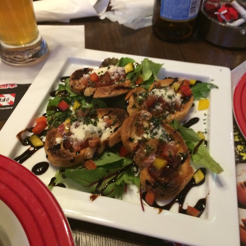 Garlic Toast with Tomato Basil(T.G.I FRIDAYS 渋谷神南店 （ティージーアイ フライデーズ）)