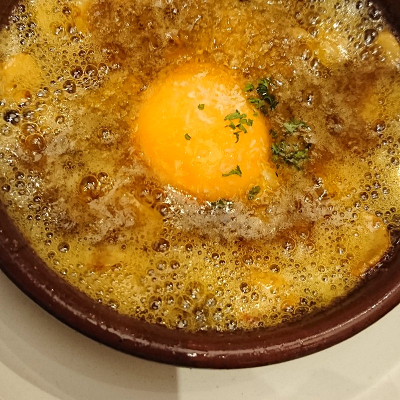 蟹と蟹味噌のアヒージョ(ハモネリア ベジョータ ギョクロ)