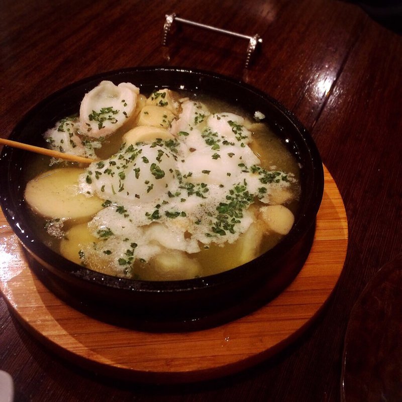 北海産水タコとエリンギのアヒージョ(ダパウロ （RotisserieBar Dapaulo）)