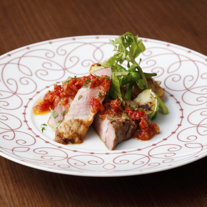 豚ロースのグリル　トマトソースと共に(gina （ジーナ【旧店名】リミテッド）)