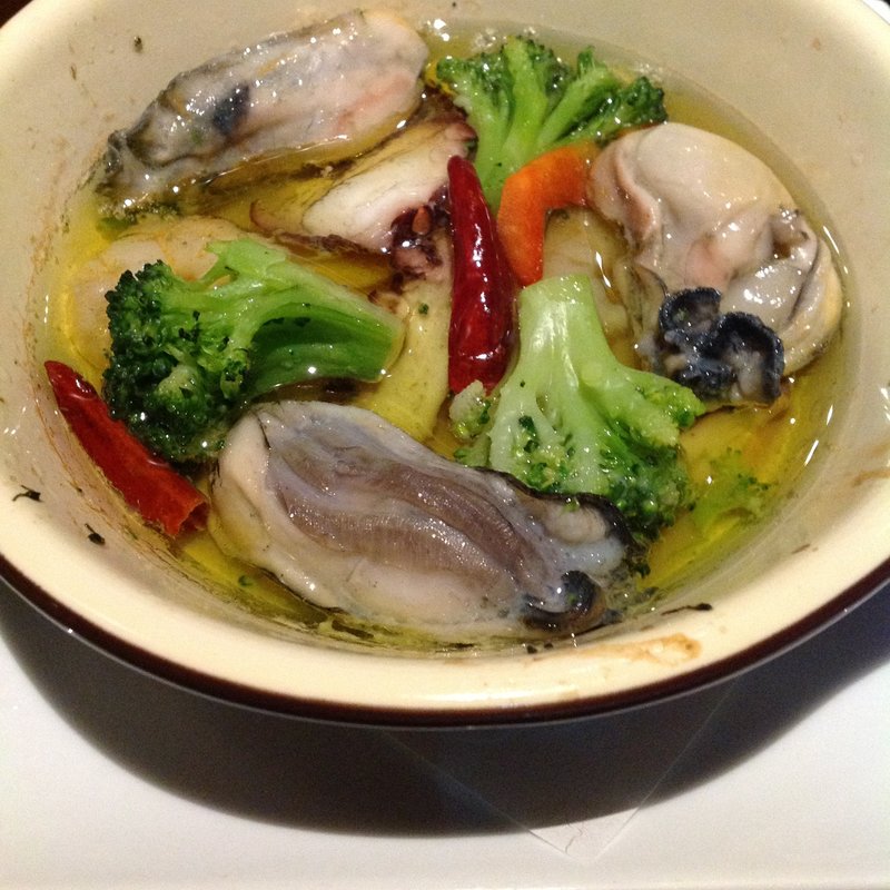 牡蠣のアヒージョ(活菜旬魚　さんかい　環状通東店)