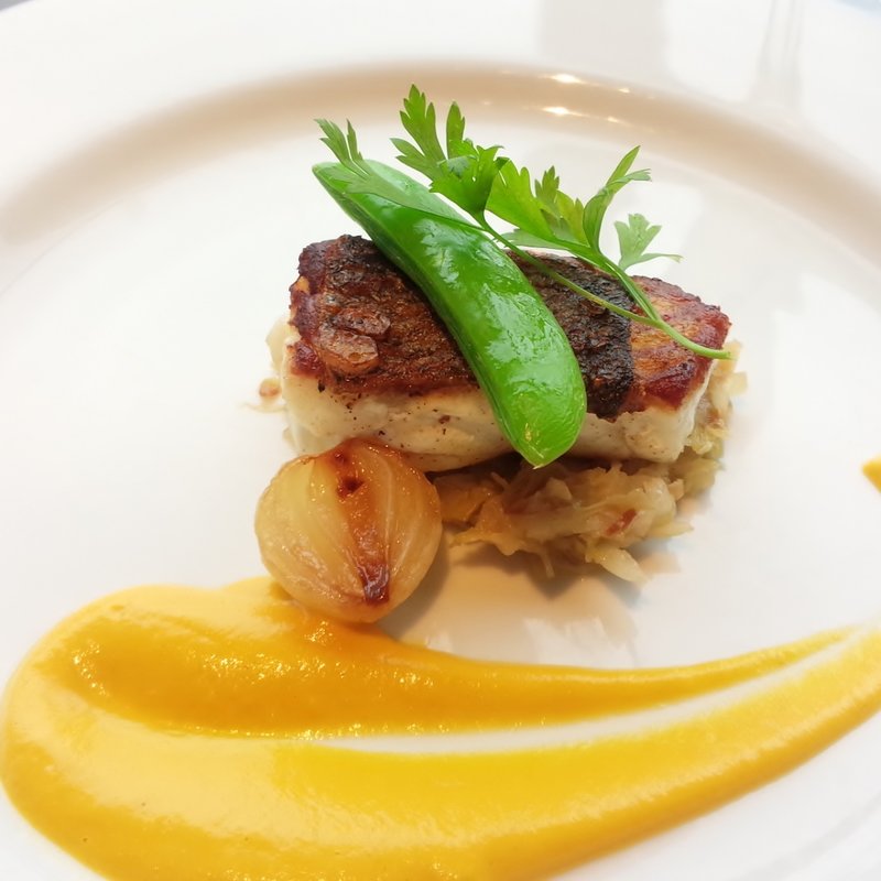 スズキのポワレ　キャロットソース(イルピノーロ スカイテラス そごう横浜店 （IL PINOLO SKY TERRACE【旧店名】イルピノーロ・レヴィータ）)