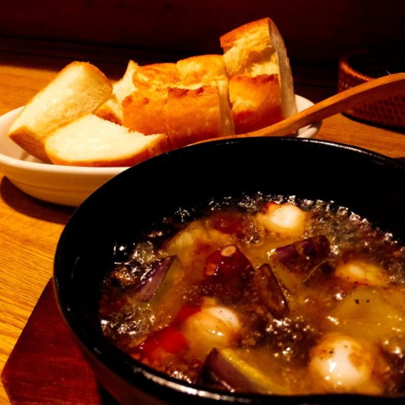 水茄子とタコのアヒージョ(トリップ)