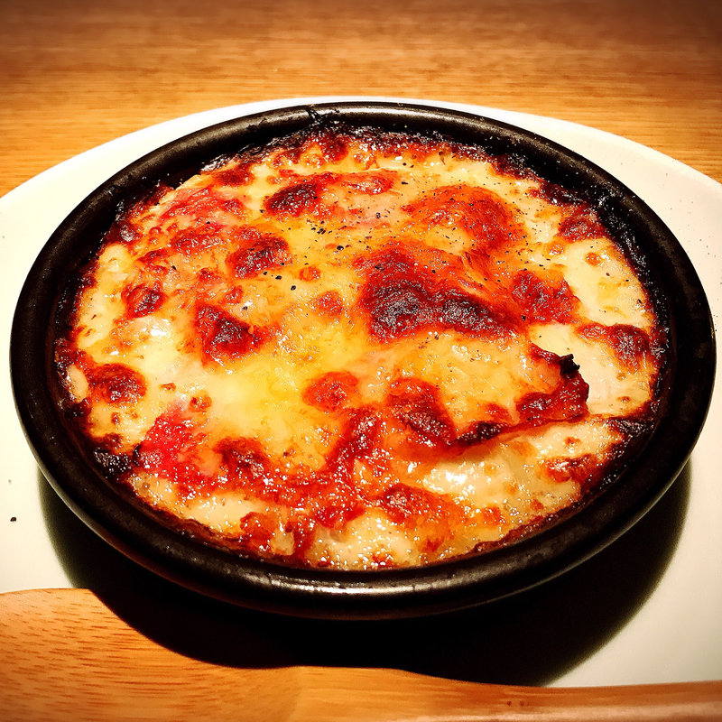 蕗のとうと粒貝グラタン(高太郎 （こうたろう）)