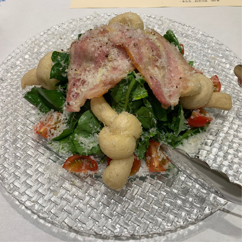 窯焼きパンチェッタとルッコラトマトのアンジョレッティ (ピッツェリア・パドリーノ・デル・ショーザン （PIZZERIA PADRINO DEL SHOZAN）)