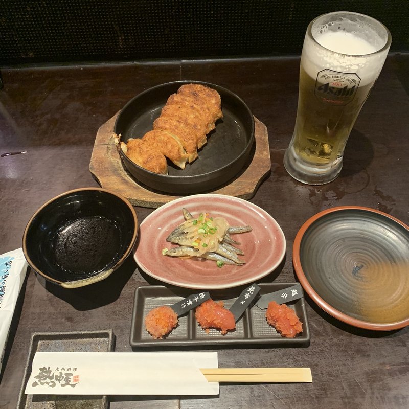 お通し明太子&鉄板餃子ハーフ&きびなご南蛮&生ビール(九州 熱中屋 神保町 LIVE （ネッチュウヤジンボウチョウライブ）)