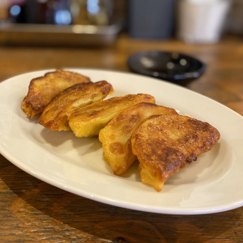 名物 焼ぎょうざ(黒豚ぎょうざと中華食堂 米吉 泉店)