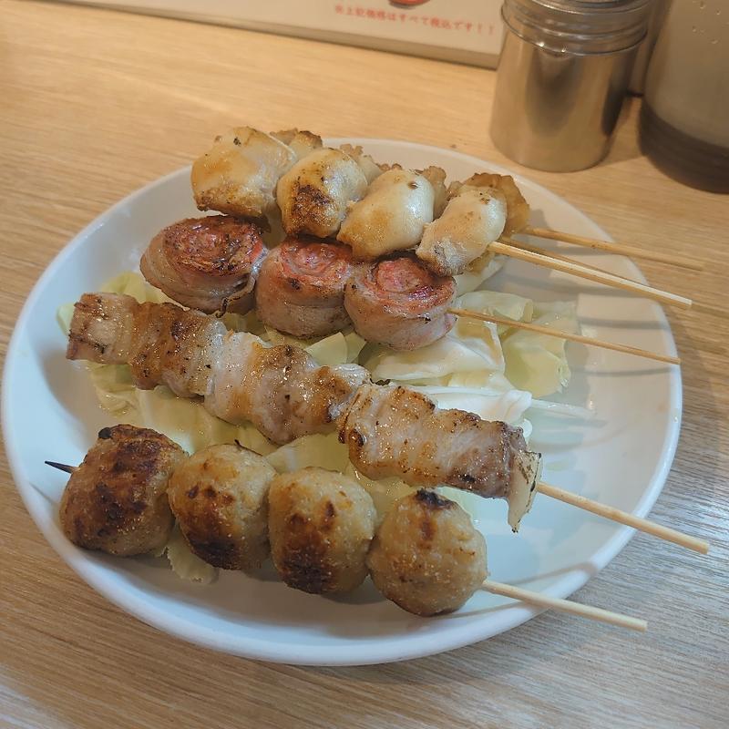 ニンニク鶏皮巻串(長浜屋台 やまちゃん中洲店)