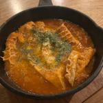 グリーンオリーブとトリッパのトマト煮込み