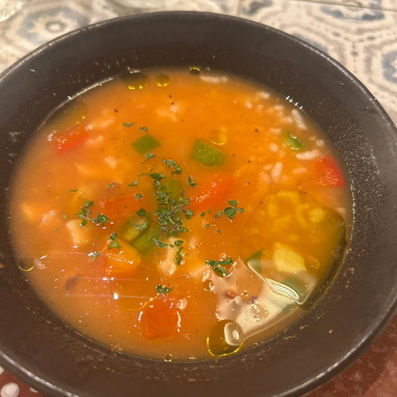 タコの雑炊(マヌエル ヴィーニョ エ ペティスコス 自由が丘店)